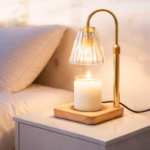 candle warmer lamp sitting on night stand beside bed.