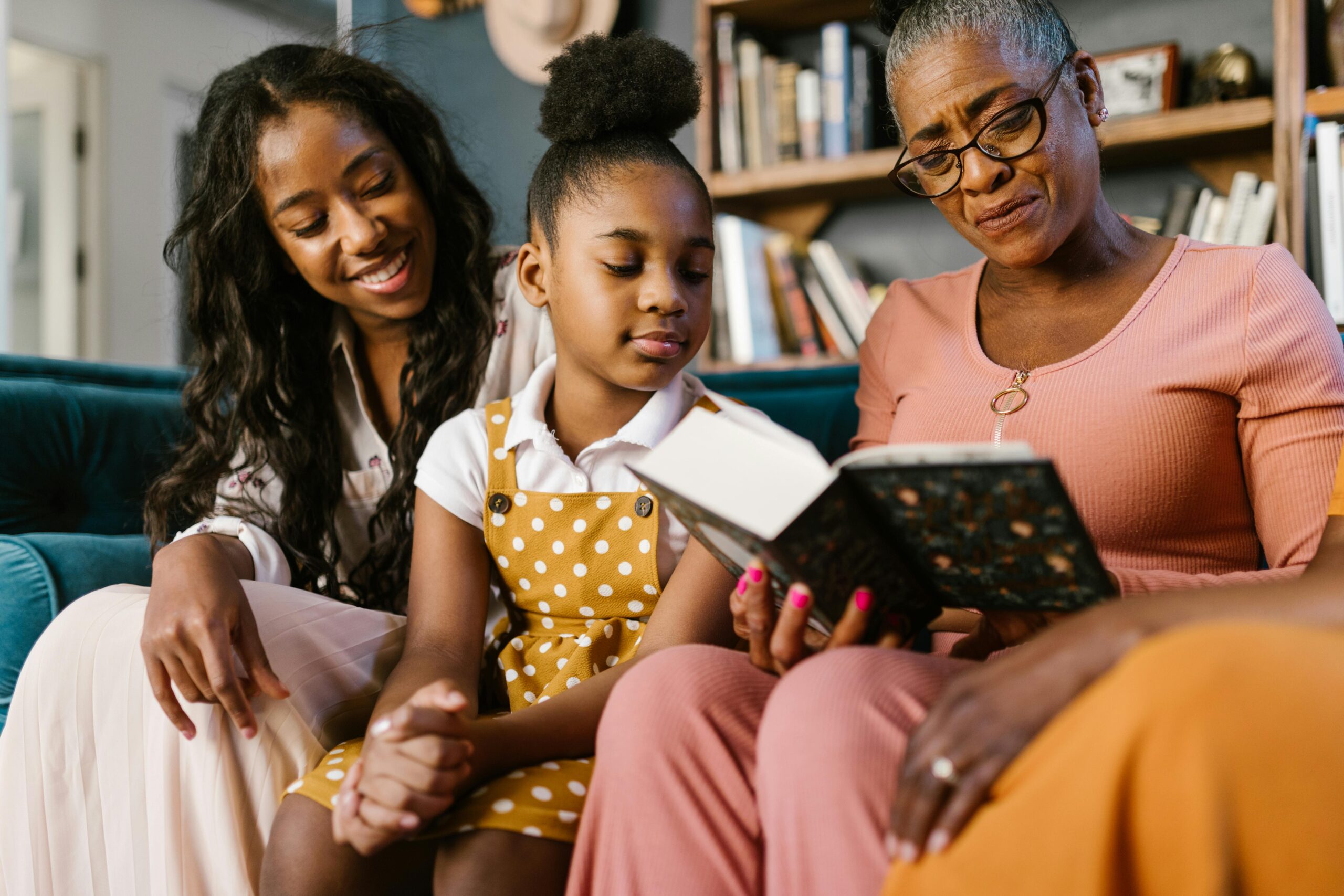 Black family reading together representing healing and mental wellness in the Black community