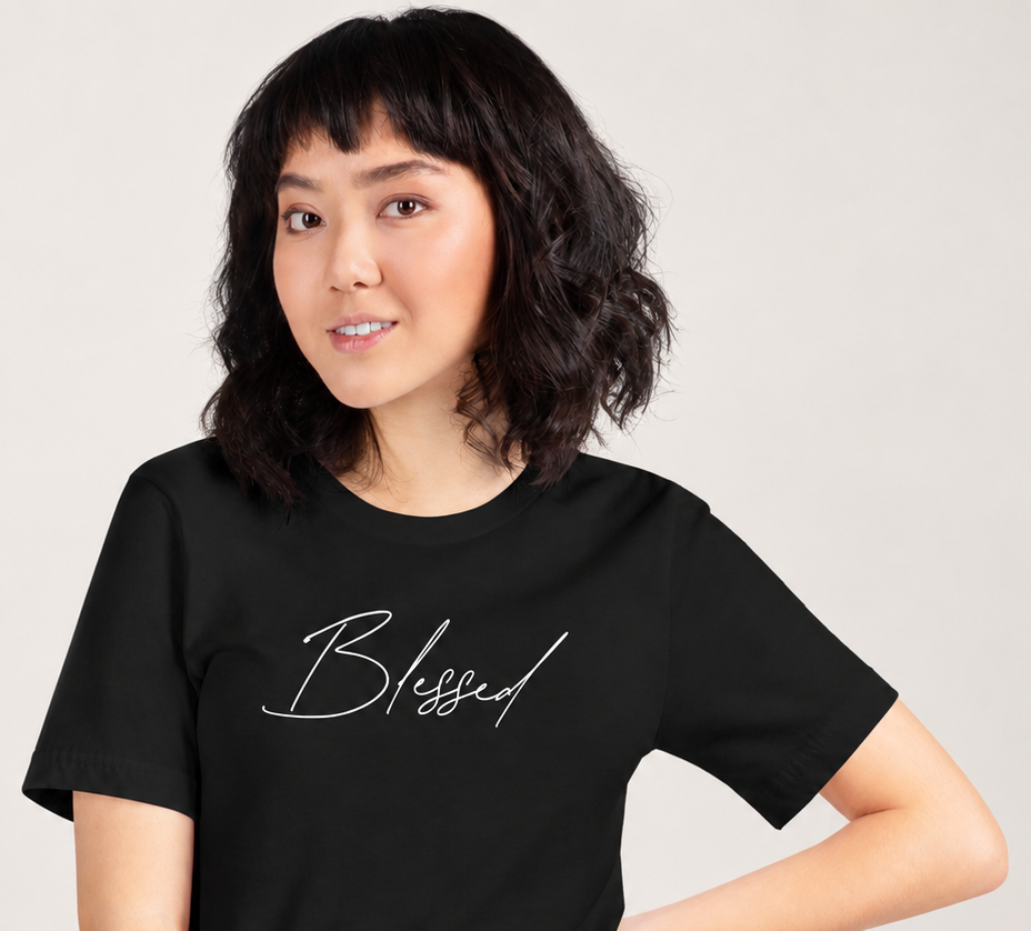 Woman wearing black Blessed Tee with minimalist faith-based script design
