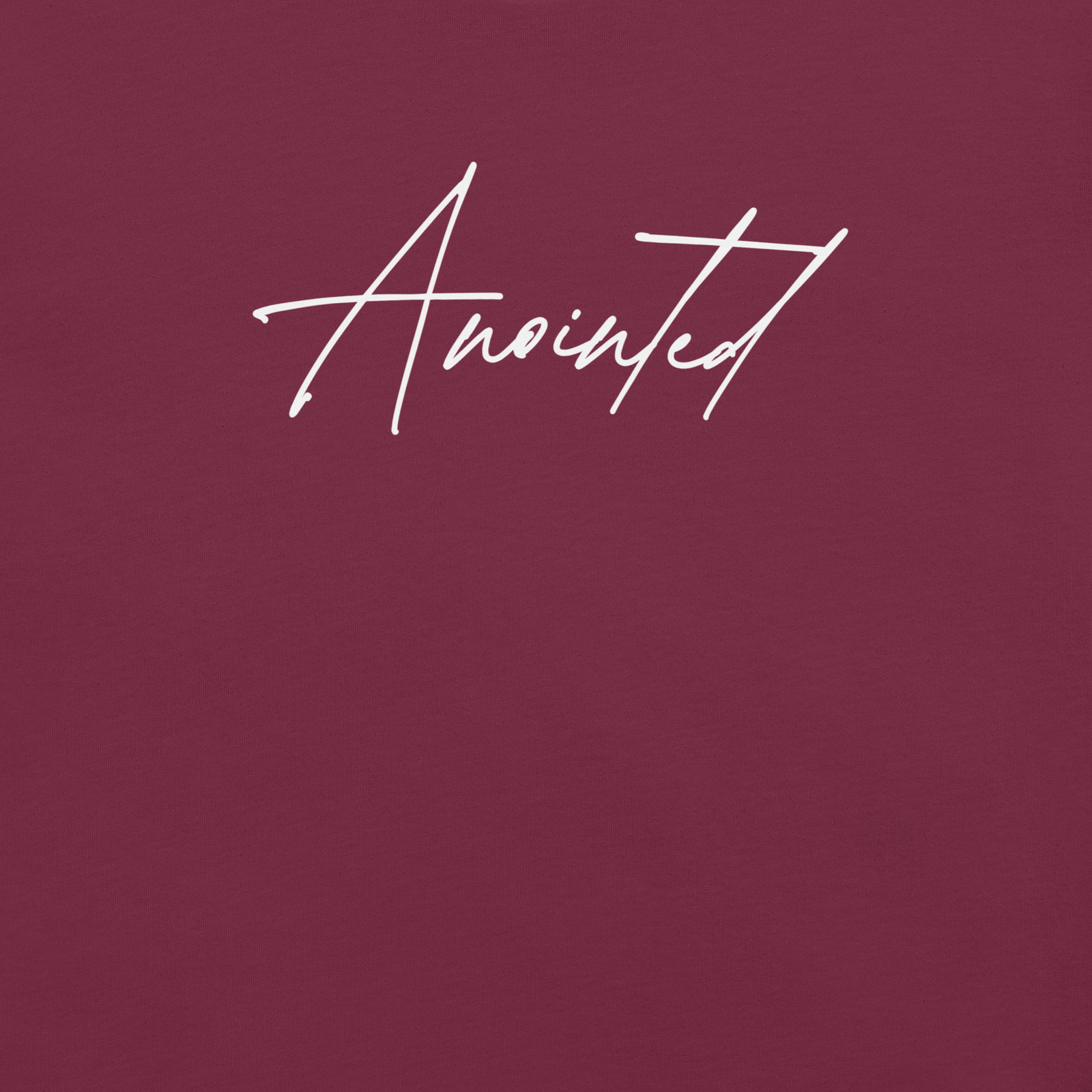 Close-up of Anointed script design on maroon faith-based tee